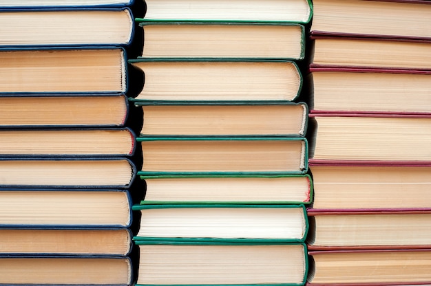 Stack of books with hardcover books background