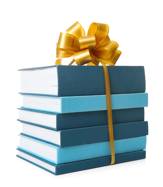 Photo stack of books with ribbon as gift on white background