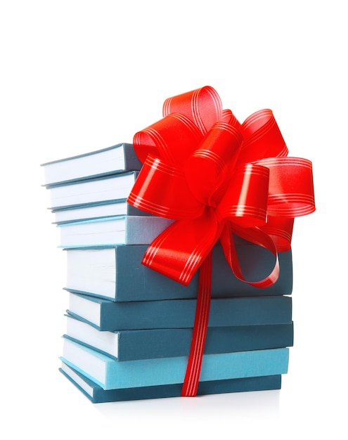 Stack of books with ribbon as gift on white background