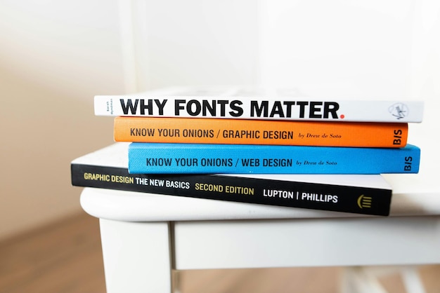 Photo a stack of books with the words why fonts matter