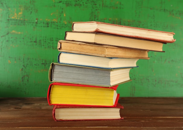 Stack of books on wooden background