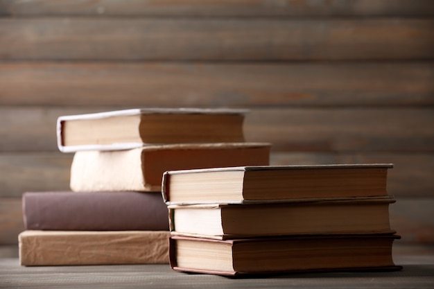 Stack of books on wooden planks