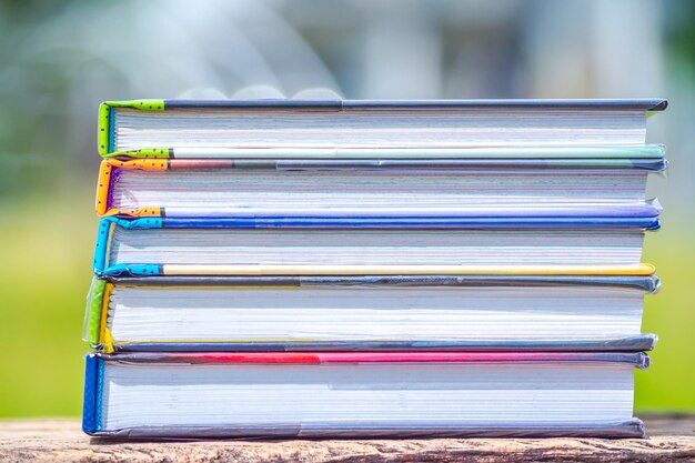 Photo stack of books on wooden table