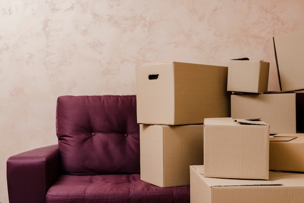 Photo stack of boxes near sofa