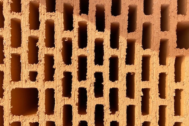 A stack of bricks made of red light clay Environmentally friendly building material hollow clay brick