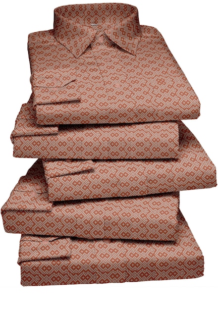 A stack of brown linens with a red pattern on the bottom.