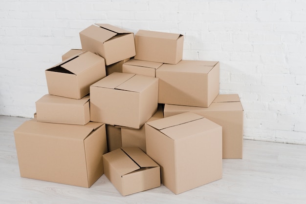 Stack of cardboard boxes in the empty room