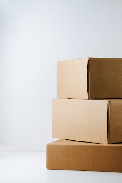 Stack of cardboard boxes on white background