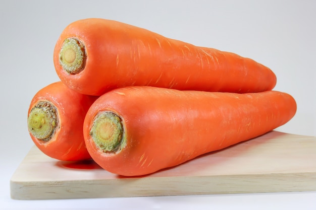 Stack of carrots on the Chopping board.