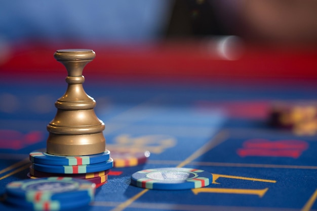 Photo stack of chips on roulette table in casino