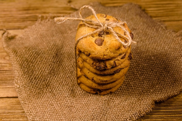 Stack of the chocolate chip cookies on sackcloth