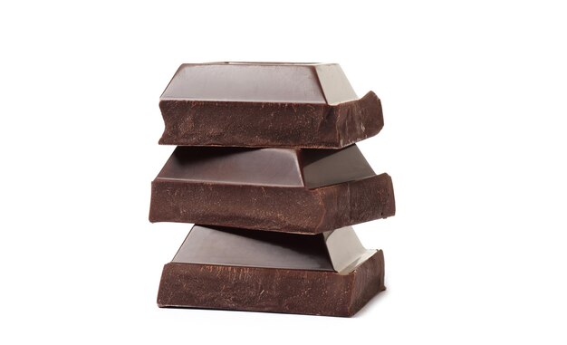 Stack of chocolate pieces on a white background