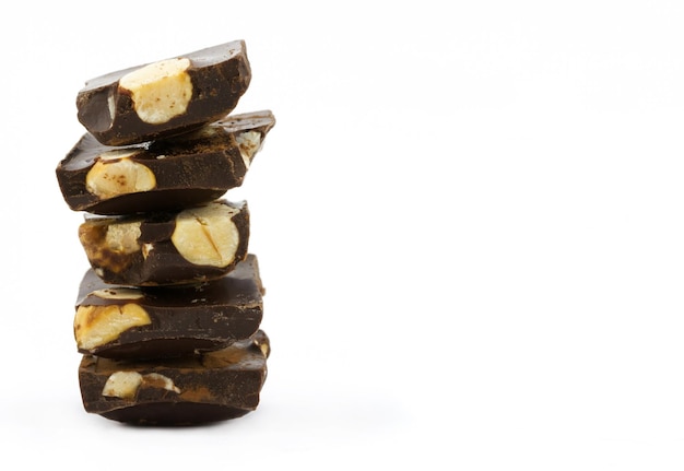 Stack of chocolate pieces with nuts