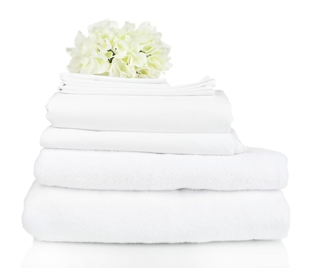 Stack of clean bedding sheets isolated on white