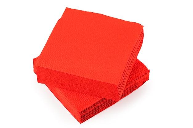 Stack of clean red paper napkins on a white background.