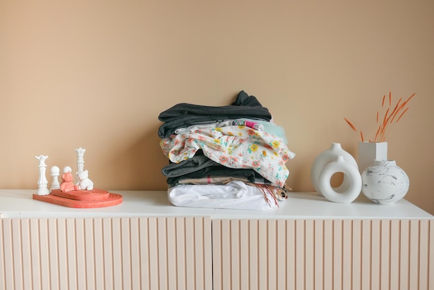 Stack of clothes on table indoor