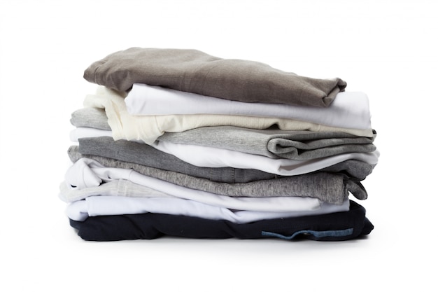 Stack of clothes on white , closeup