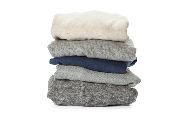 Stack of clothes on white , closeup