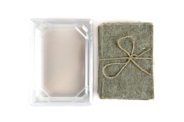 Stack of coconut coir and plastic substrate on a white background Growing microgreens at home