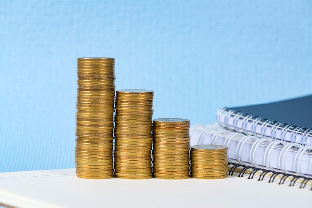 Stack of coins over book