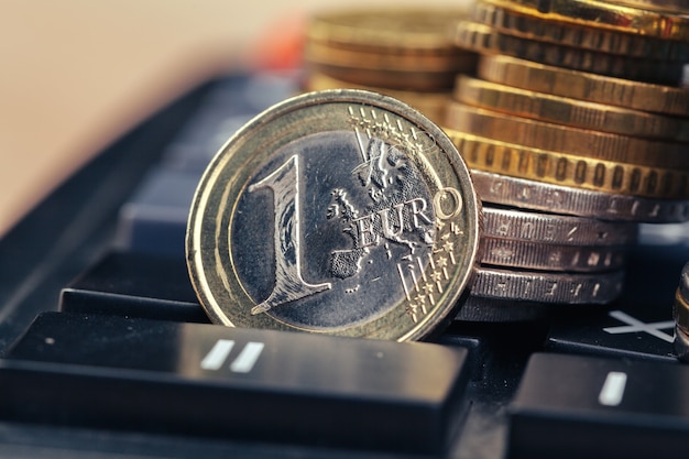 stack of coins and calculator, concept for business finance