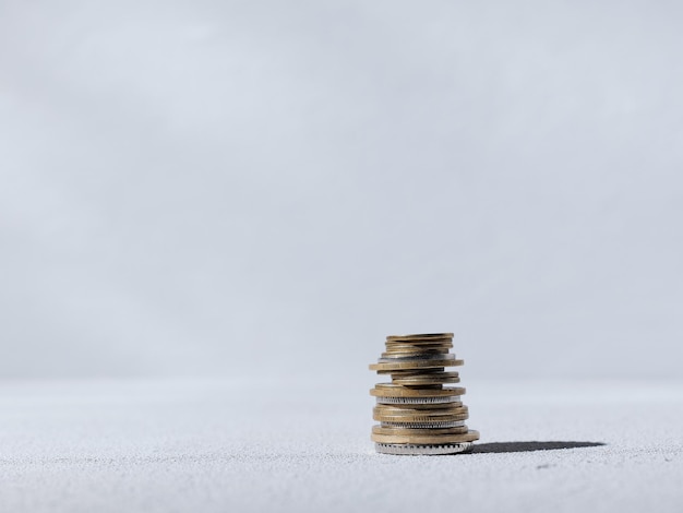 Stack of coins on gray background