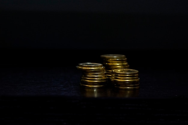 Stack of coins isolated on black