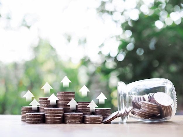 Stack of coins with arrow rising icons The concept of business growth Financial investment Market stock Profit return Dividend and Business fund