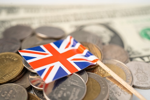 Stack of coins with United Kingdom flag.