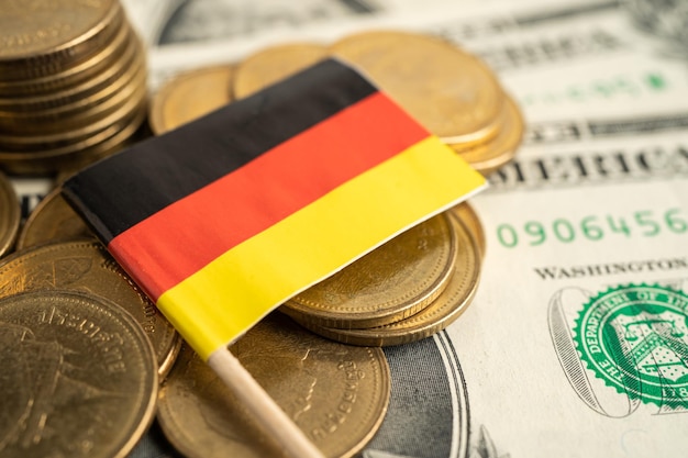 Stack of coins with USA Germany flag on white background