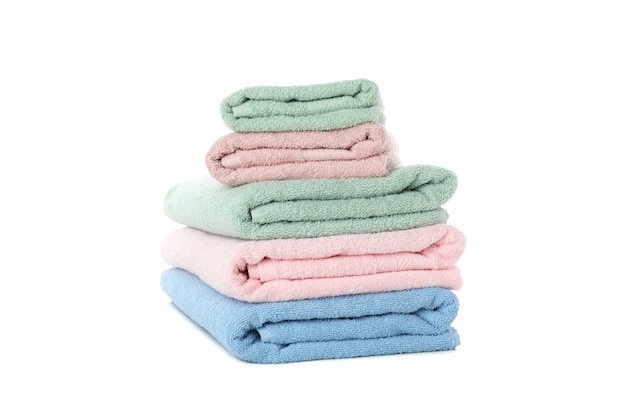 Stack of colored towels isolated on white background