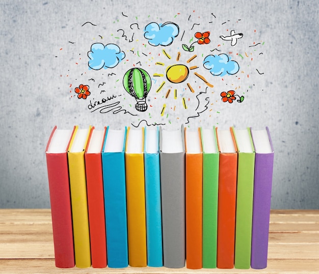 Stack of colorful books on background