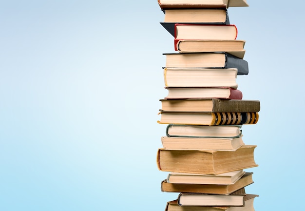 Stack of colorful books on  background