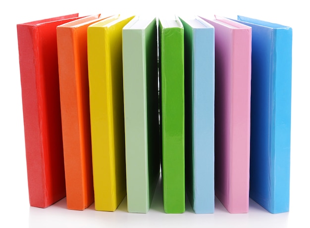 Stack of colorful books on white