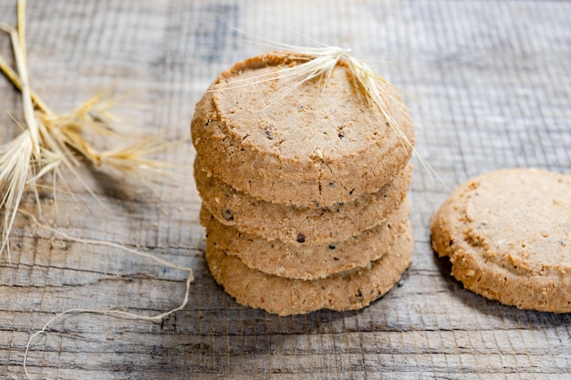 A stack of cookies with a burlap bag on top