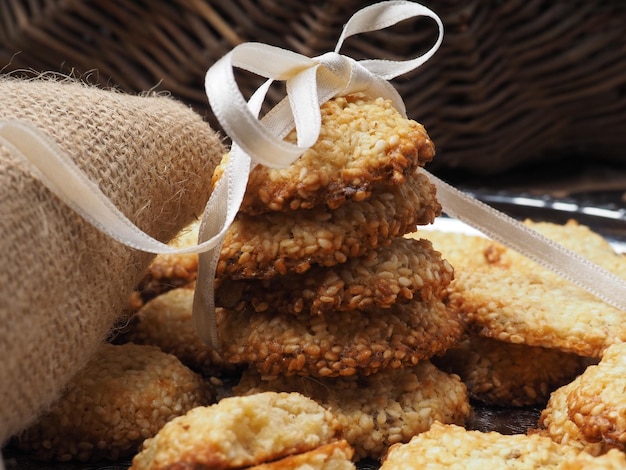 A stack of cookies with a ribbon tied around it