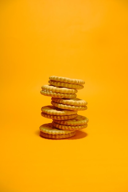 A stack of cookies with a yellow background