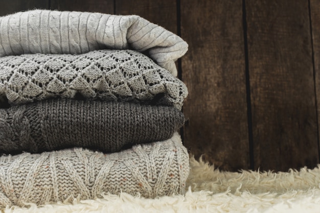 Stack of cozy knitted sweaters