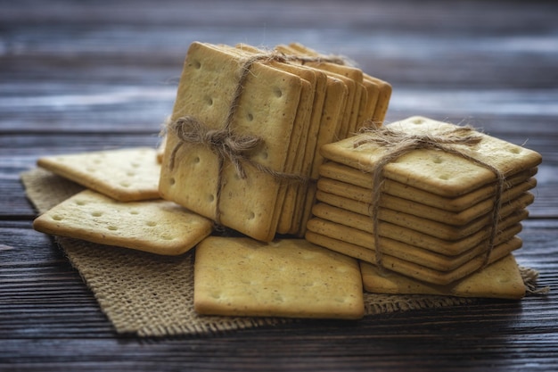 A stack of crackers tied with string on sackcloth