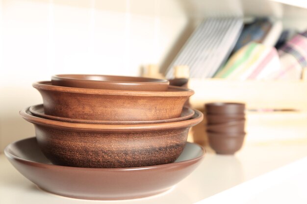 Stack of crockery on shelf