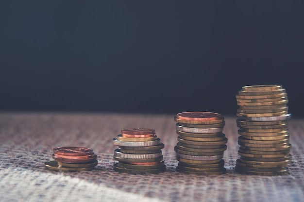 Stack Of different Coins Over Black Background