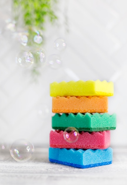 stack dish washing sponges and soap bubbles