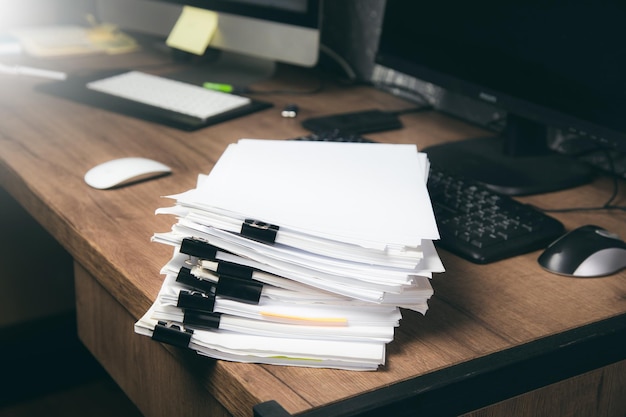 Stack of document on working table business concept