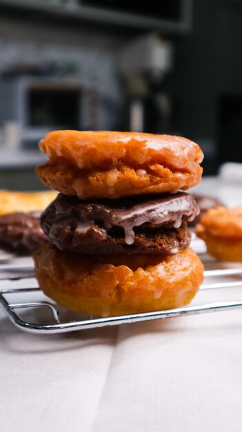 Photo a stack of donuts with one being glazed and one being glazed.