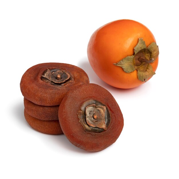 Photo stack of dried kaki persimmon and a fresh one on white background close up