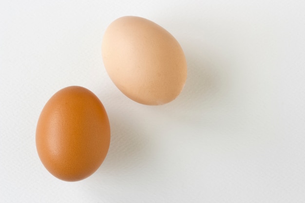 Stack of  eggs on white  texture paper