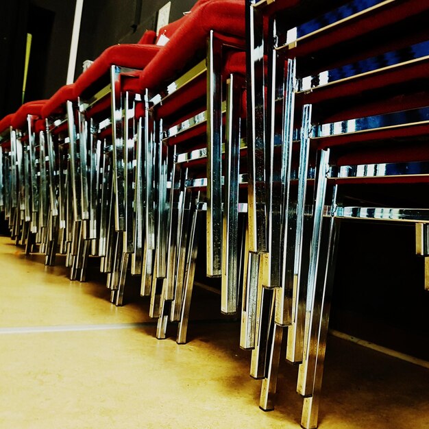 Photo stack of empty chairs in building