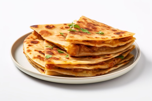 A stack of flat breads on a plate with a white background.