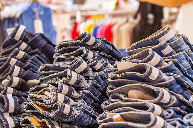 Stack of folded jeans in the store