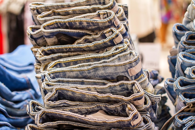 Stack of folded jeans in the store